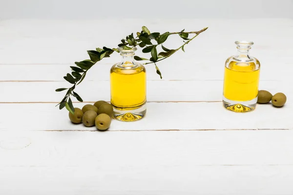 Olives and essential oil — Stock Photo