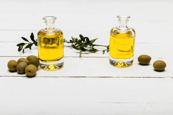 Olives and essential oil — Stock Photo