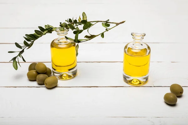 Olives and essential oil — Stock Photo