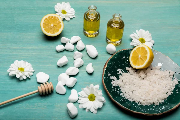 Sea salt with oil and chamomiles — Stock Photo