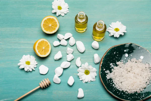 Sea salt with oil and chamomiles — Stock Photo