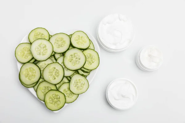 Cucumber face cream — Stock Photo