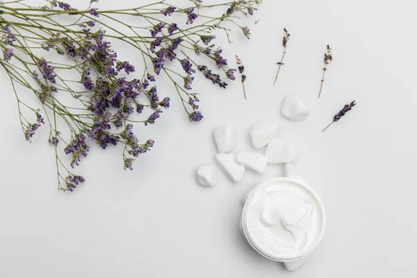 Cream and dried lavender — Stock Photo