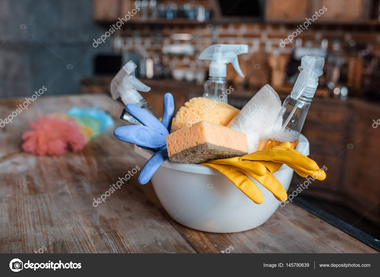 Cleaning supplies on table Stock Photo by ©YuraSokolov 145790639