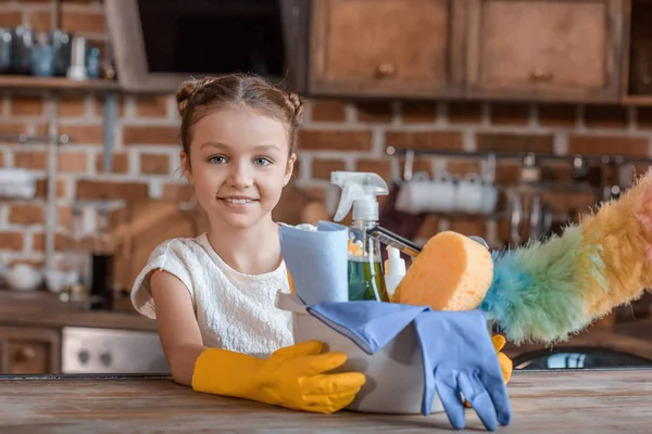 Girl with cleaning supplies — Stock Photo, Image