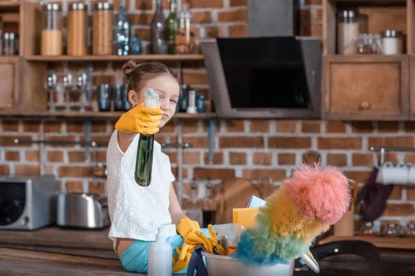 Girl with cleaning supplies — Stock Photo, Image