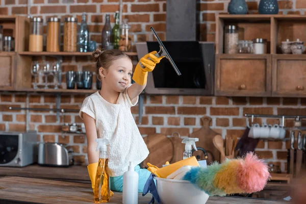 Girl with cleaning supplies — Stock Photo, Image