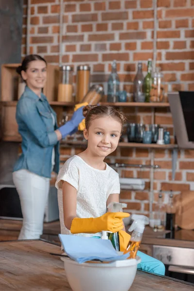 Girl with cleaning supplies — Stock Photo, Image