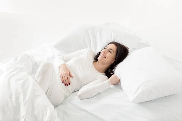 Woman in sleepwear awakening — Stock Photo, Image