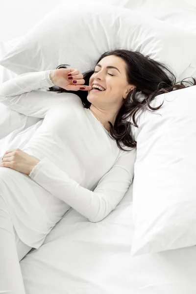 Woman in sleepwear awakening — Stock Photo, Image