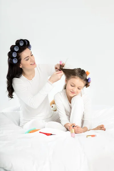 Mother and daughter in curlers — Stock Photo, Image