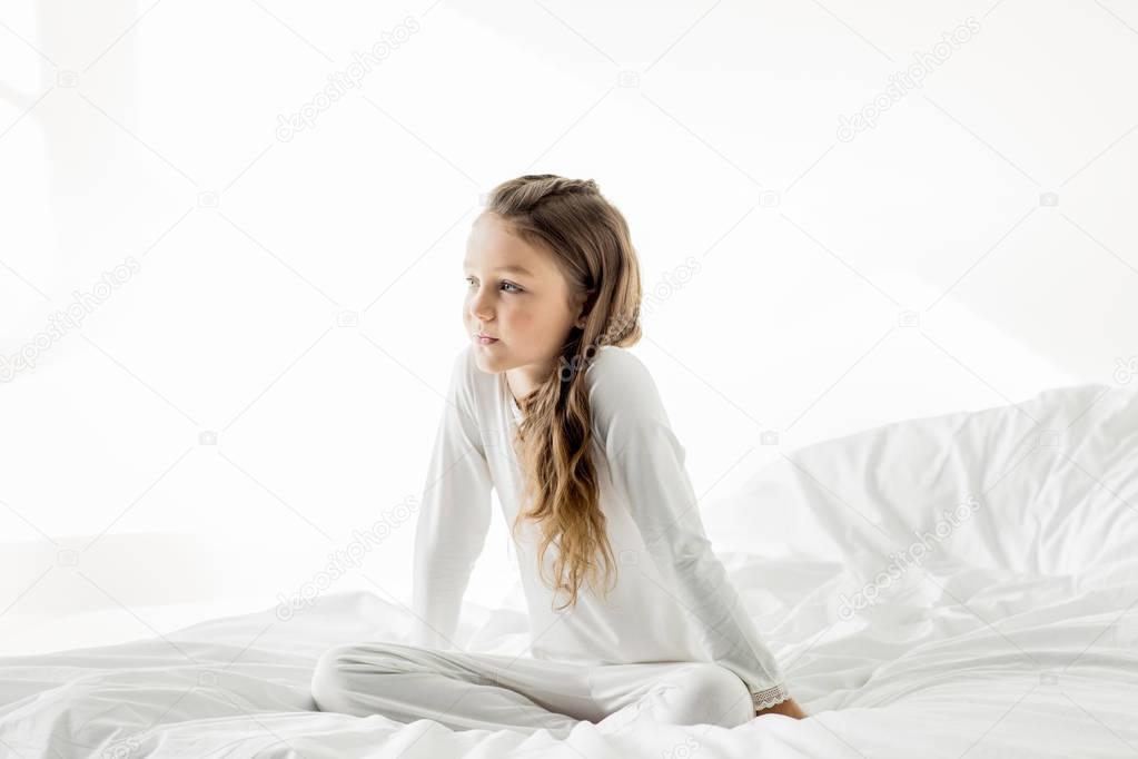 Adorable girl in bed