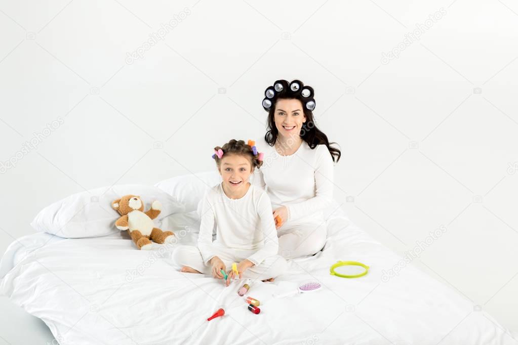 Mother and daughter in curlers 