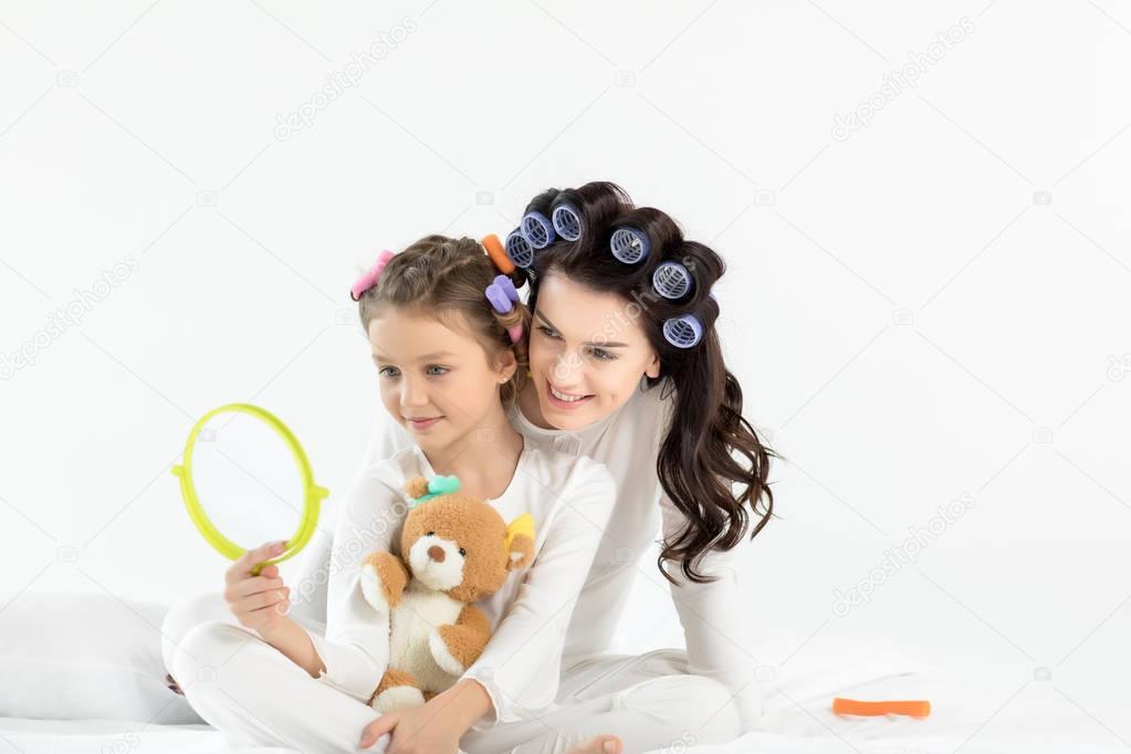 Mother and daughter in curlers 