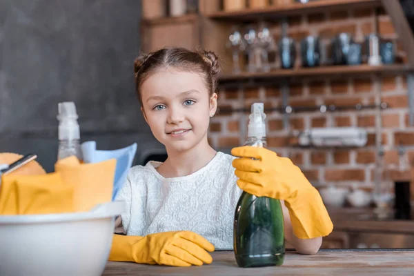 Girl with cleaning supplies — Stock Photo