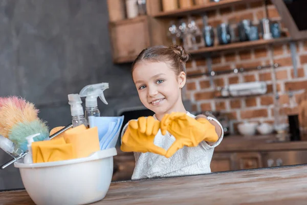 Girl with cleaning supplies — Stock Photo