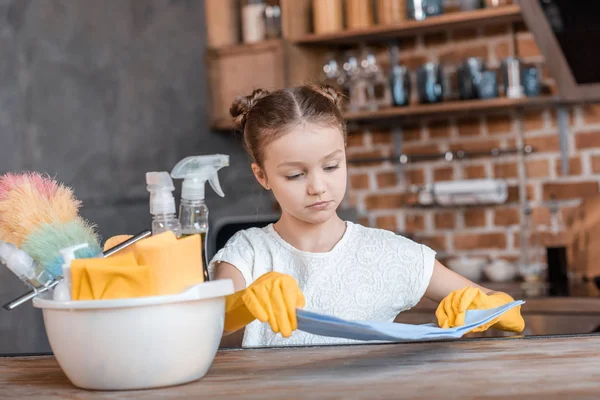 Girl with cleaning supplies — Stock Photo