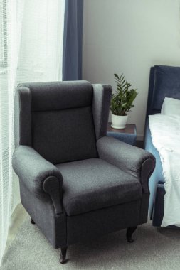modern armchair in bedroom clipart