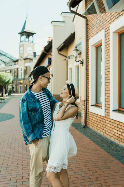 stylish couple hugging on the street