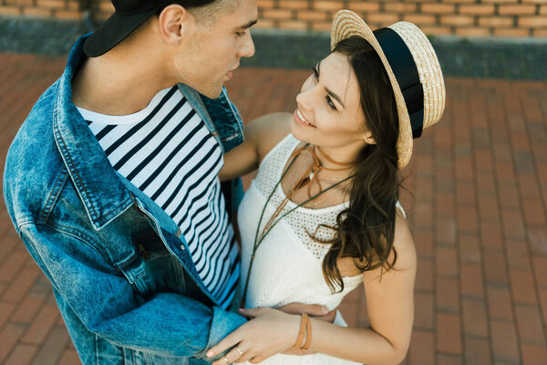 stylish couple hugging on the street