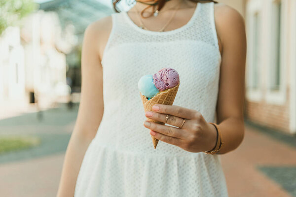 Young woman eating ice cream 