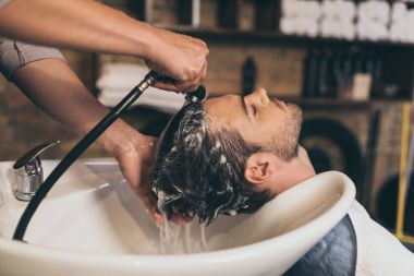 hairstylist washing clients hair  clipart