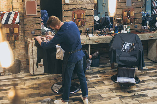 Barber shaving customer