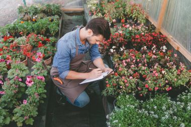 gardener making notes during work clipart