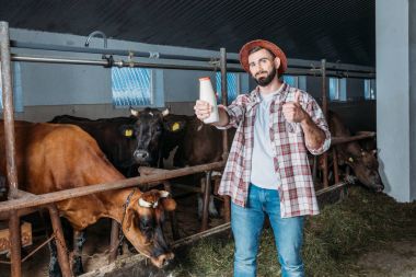 farmer with fresh milk in stall clipart