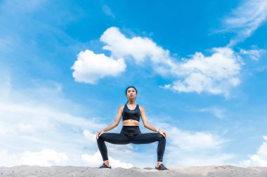 woman practicing yoga clipart