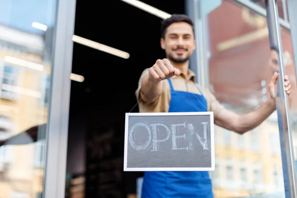 Small business owner with open sign — Stock Photo, Image