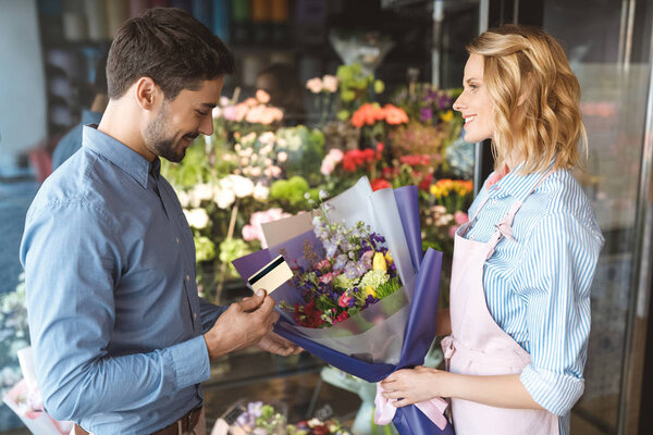 florist and client with credit card