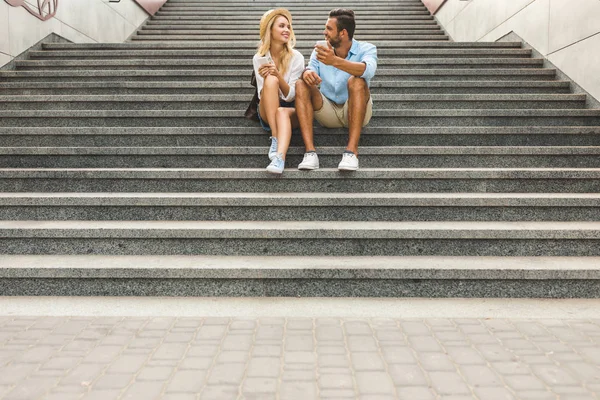 Couple with smartphones on street — Stock Photo, Image