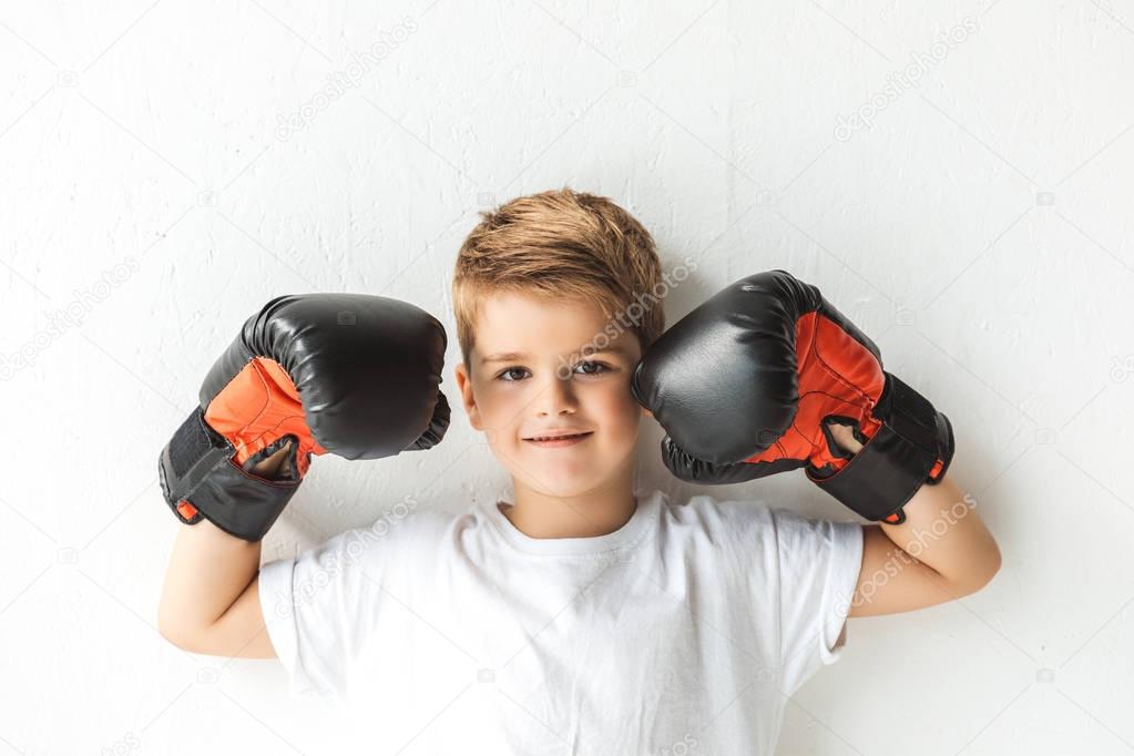 little boy in boxing gloves 