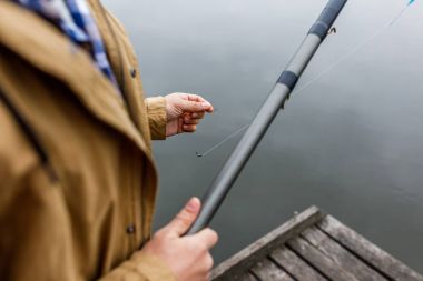 man with fishing rod and hook clipart