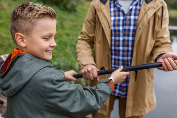 son fishing with father