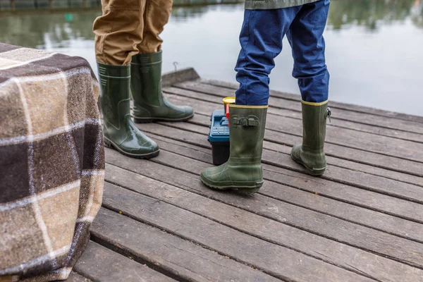 Father and son in rubber boots — Stock Photo, Image