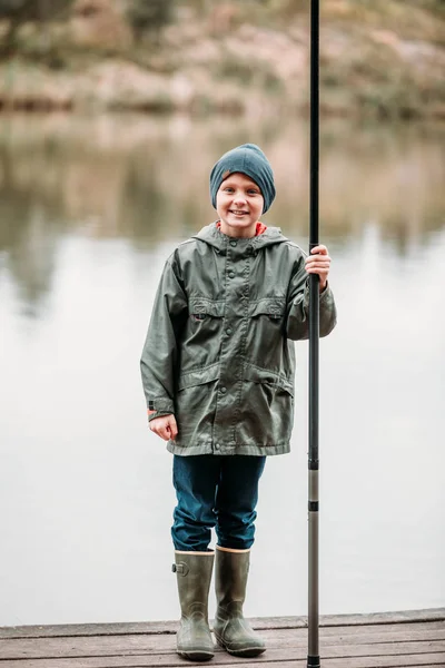 Little boy with rod — Stock Photo, Image