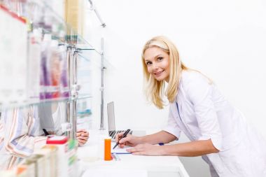 pharmacist and customer in drugstore clipart