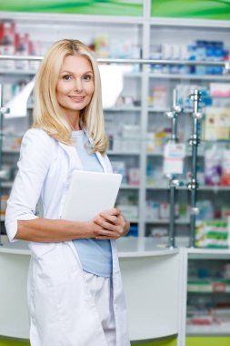 pharmacist with digital tablet clipart