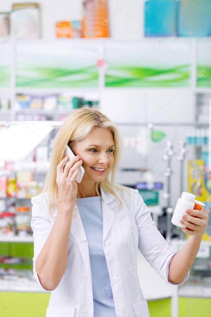 pharmacist talking on smartphone