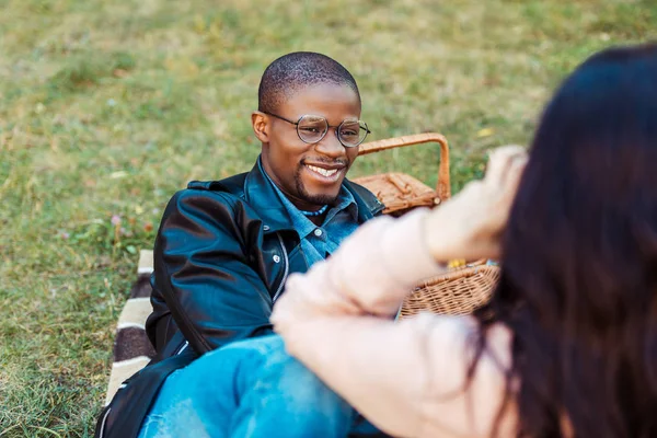 Boyfriend laughing and lying on blanket — Free Stock Photo