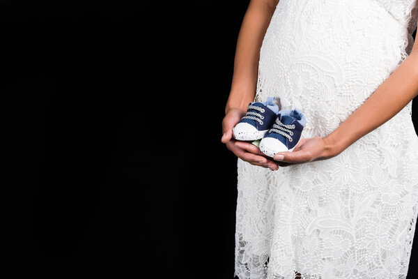 Pregnant woman with shoes  