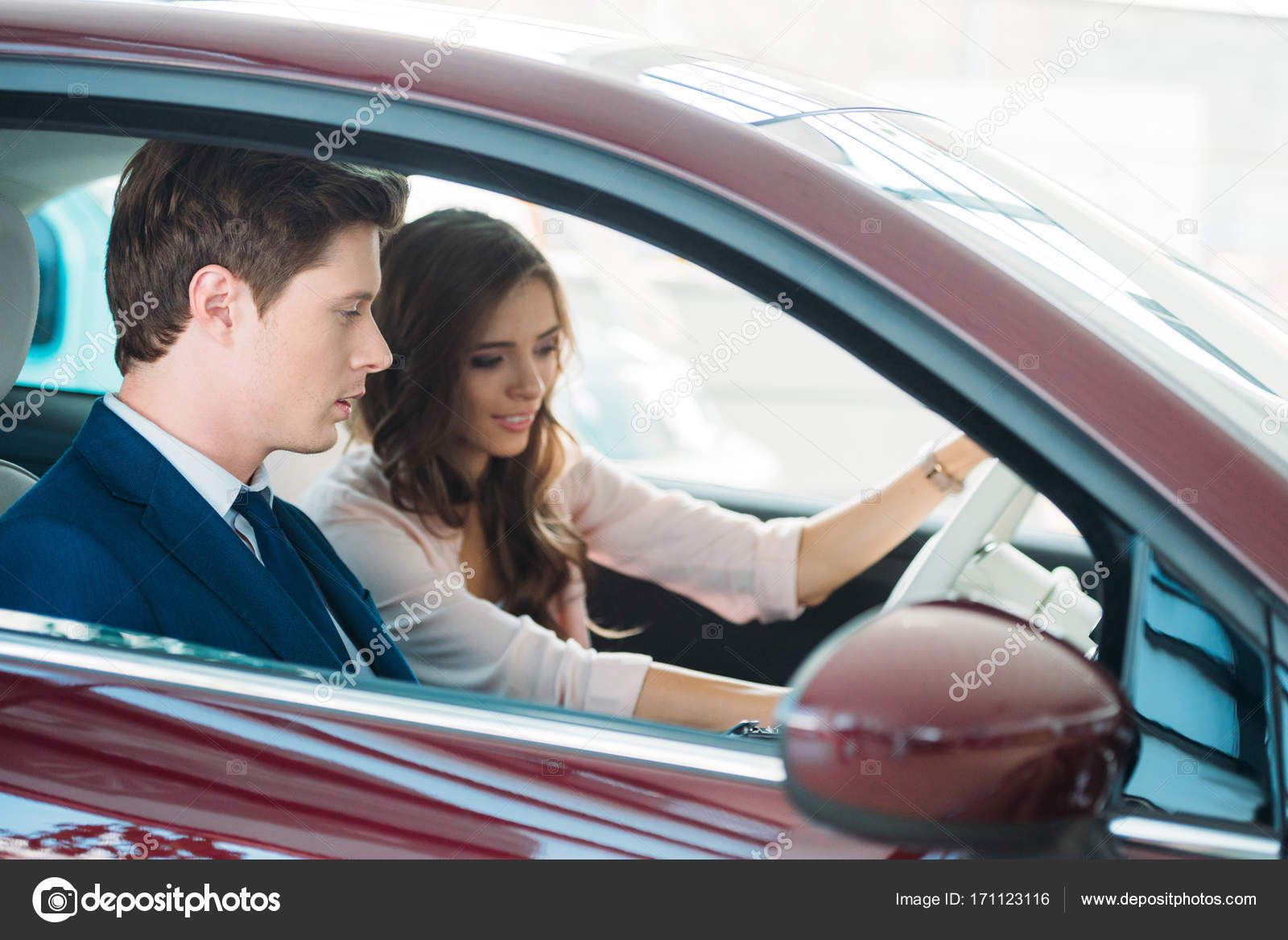 Manager sitting in car with customer — Stock Photo © SashaKhalabuzar