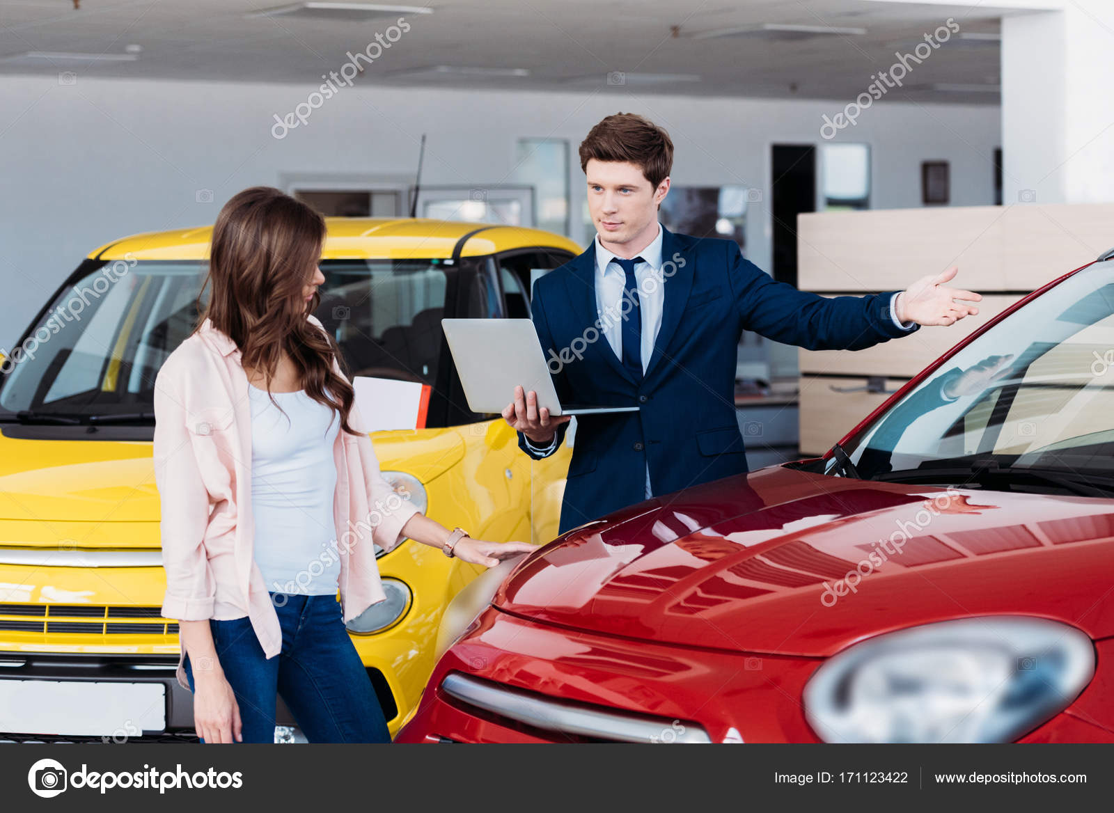 Manager showing car to customer Stock Photo by ©SashaKhalabuzar 171123422