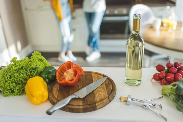Fresh vegetables and bottle of wine — Stock Photo, Image