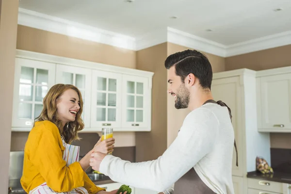 Young loving couple in kitchen — Stock Photo, Image