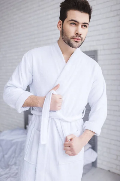 Handsome Young Man Tying Belt Bathrobe Looking Away Home — Stock Photo, Image