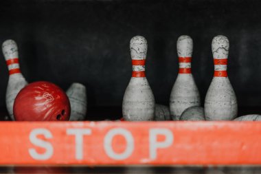 bowling ball crushing pins behind stop sign clipart