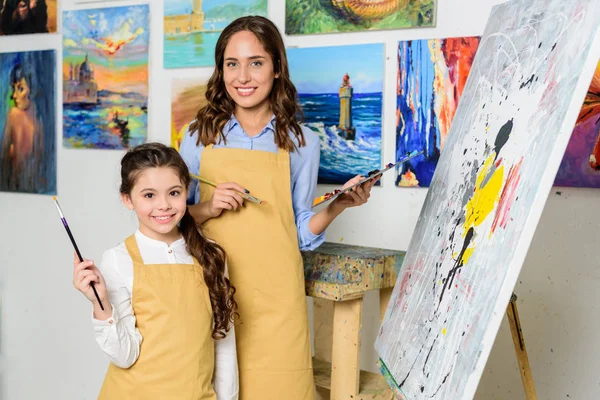 Smiling Teacher Pupil Standing Canvas Easel Workshop Art School — Stock Photo, Image